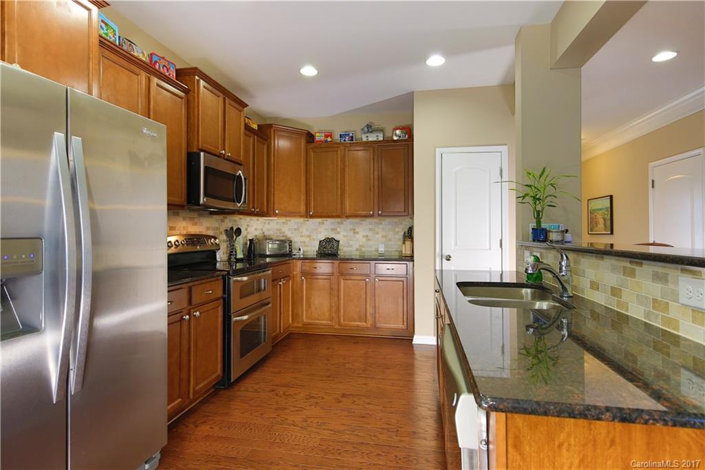79291 Ridgehaven Road Lancaster, SC 29720 - Photo 9 of 23 a kitchen with stainless steel appliances granite countertop a refrigerator a stove and a sink
