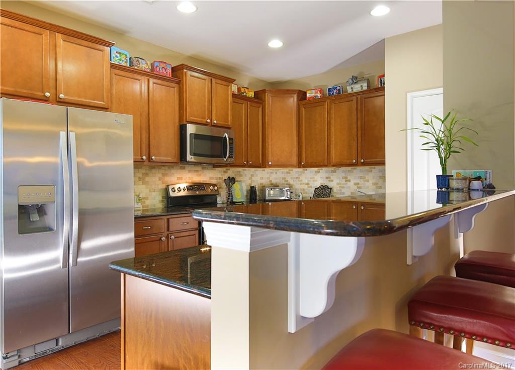 79291 Ridgehaven Road Lancaster, SC 29720 - Photo 10 of 23 a kitchen with stainless steel appliances granite countertop a refrigerator a stove and a sink