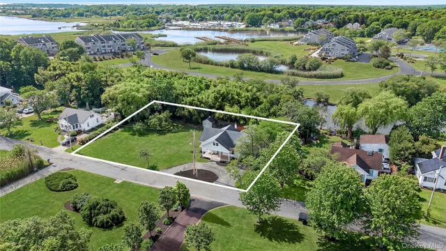 an aerial view of house with yard swimming pool and outdoor seating