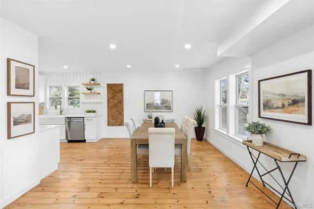 a dining room with furniture and wooden floor