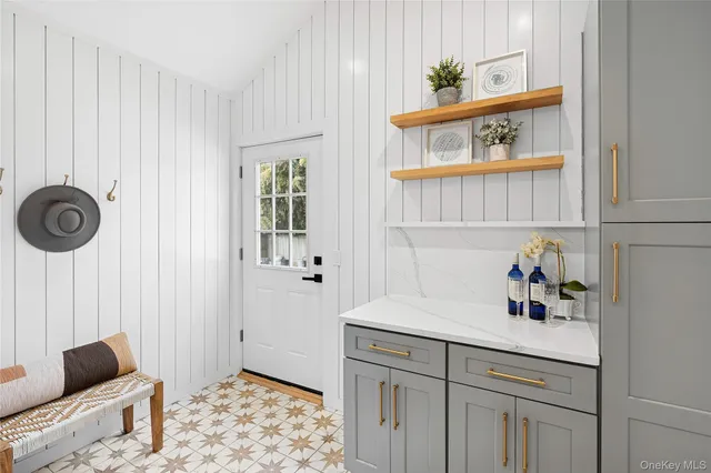 a kitchen with a refrigerator and a stove