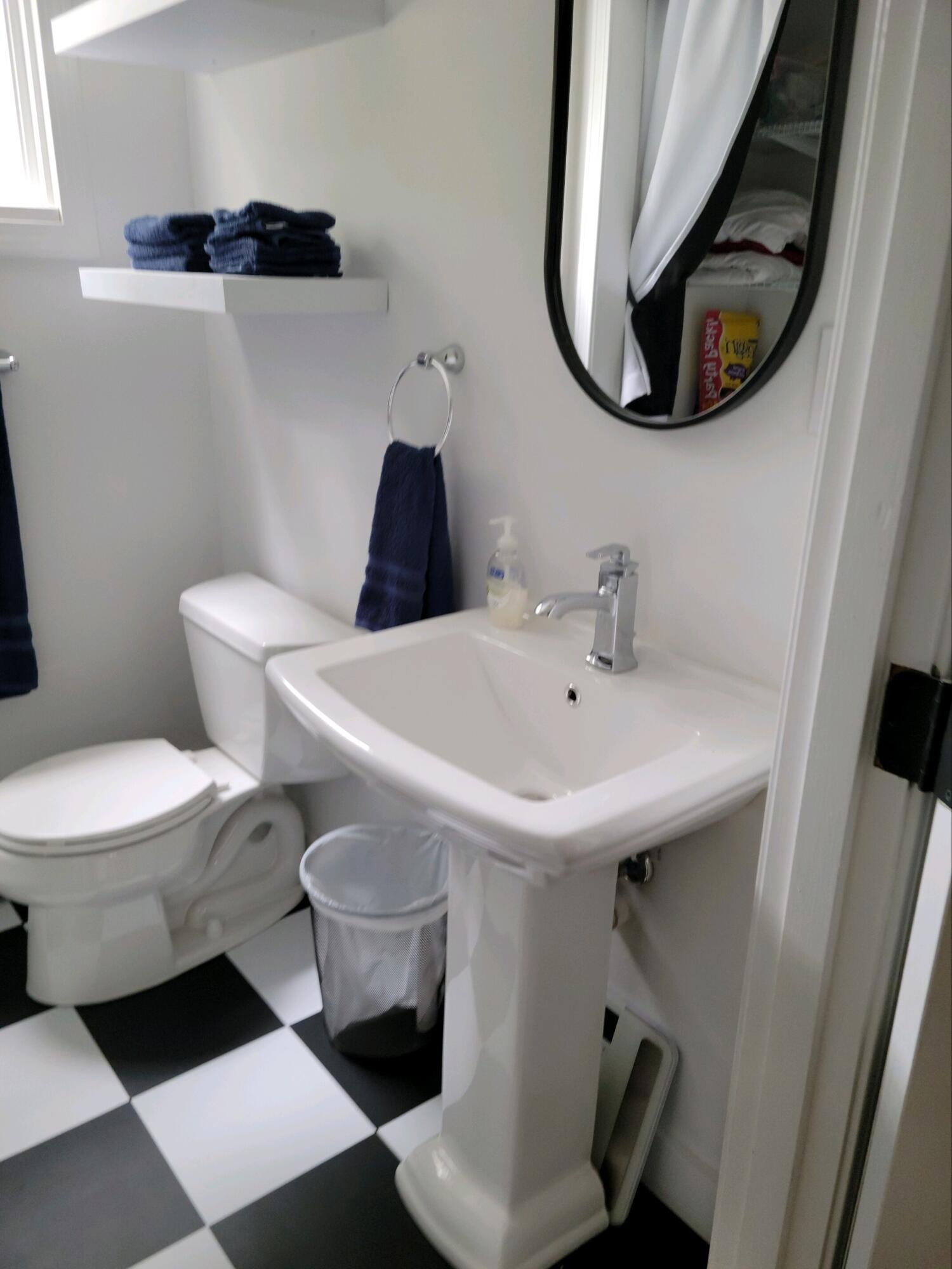 863 Bumps River Road Centerville, MA 02632 - Photo 14 of 22 a bathroom with a sink and a mirror