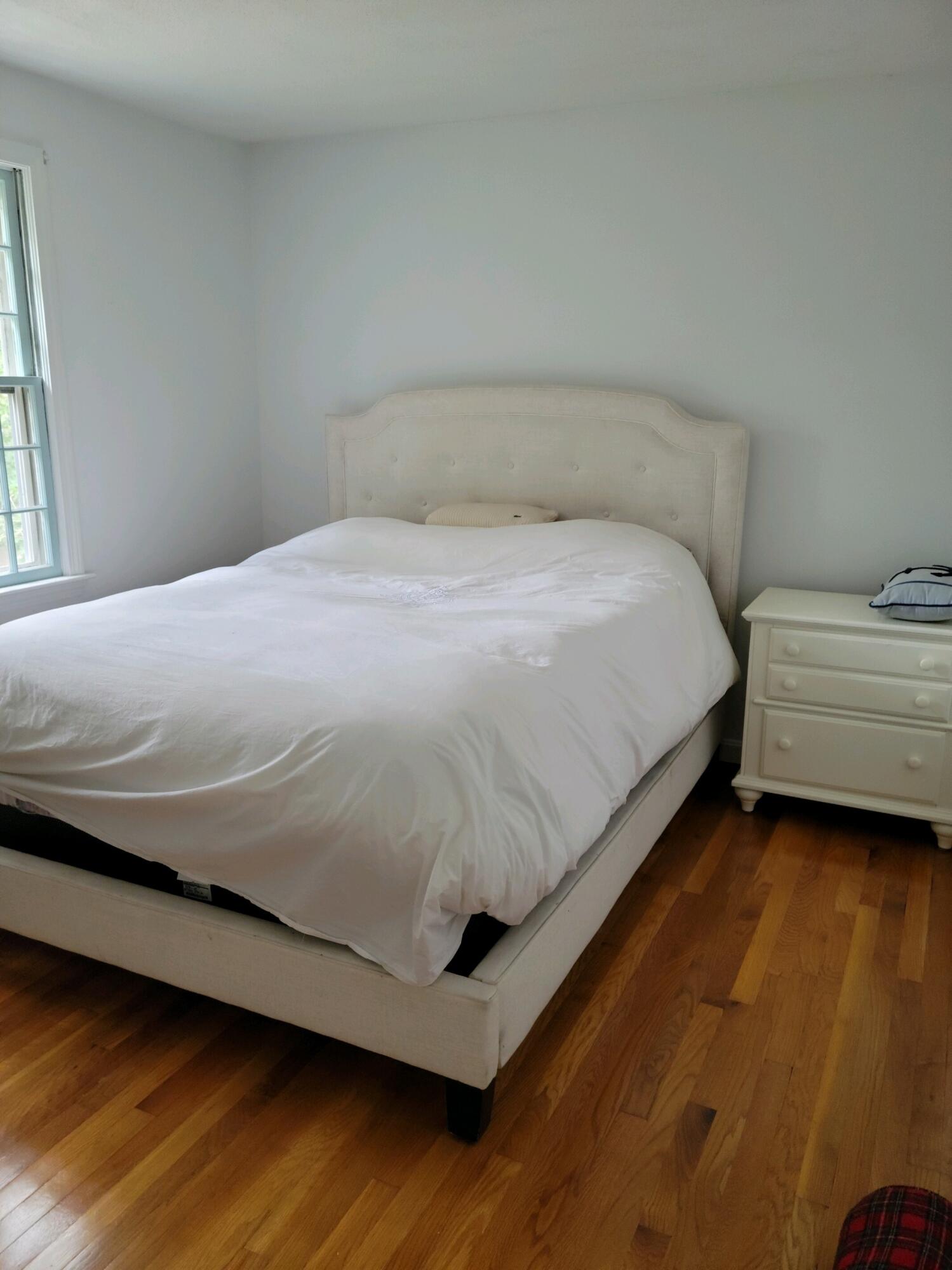 863 Bumps River Road Centerville, MA 02632 - Photo 15 of 22 a bedroom with a bed and window