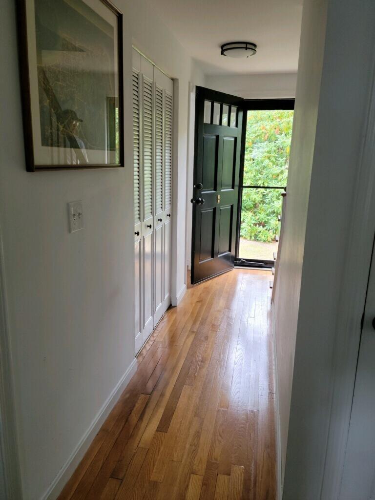 863 Bumps River Road Centerville, MA 02632 - Photo 18 of 22 a view of a room with wooden floor and a window
