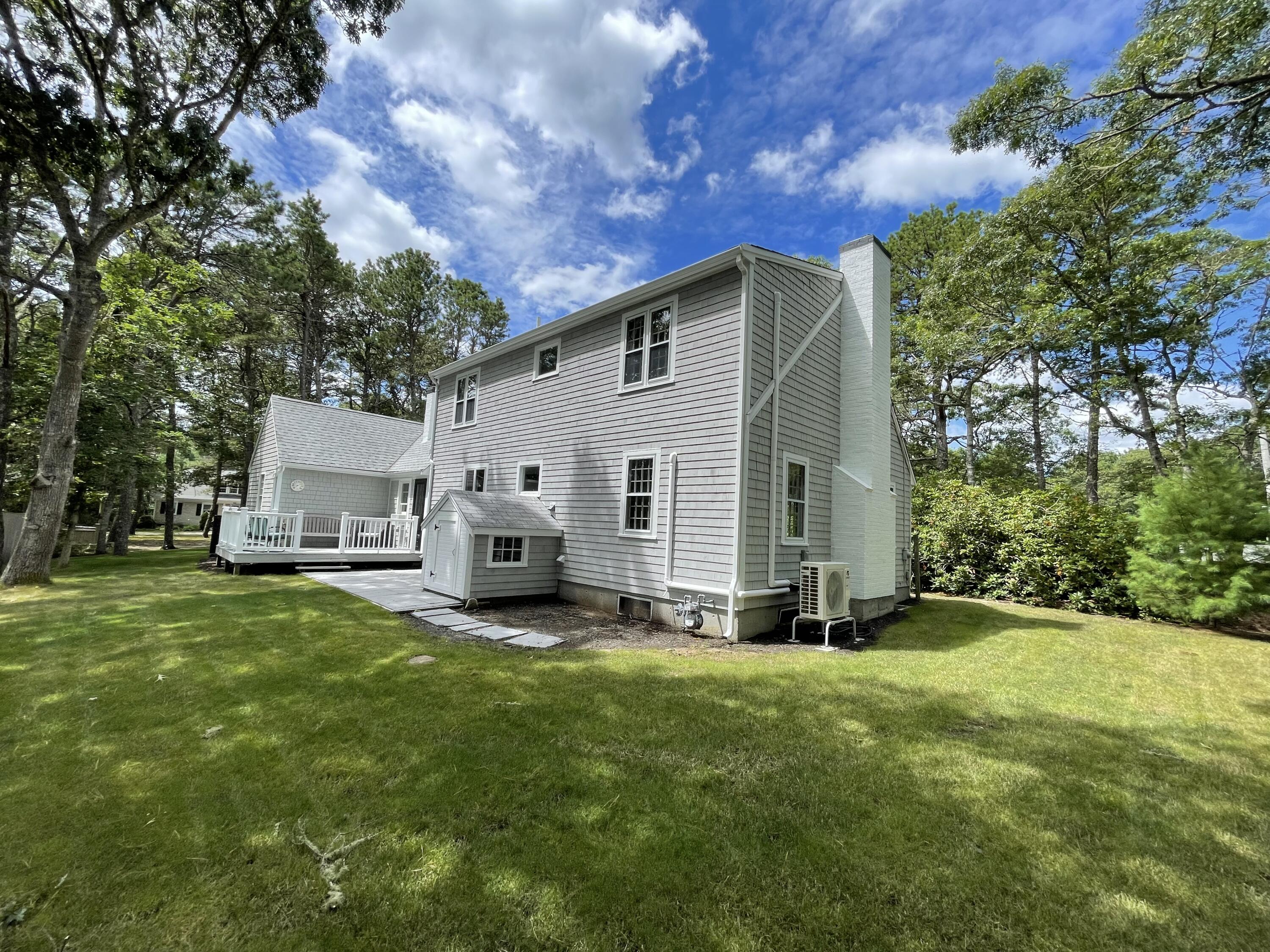 863 Bumps River Road Centerville, MA 02632 - Photo 4 of 22 a view of a house with backyard