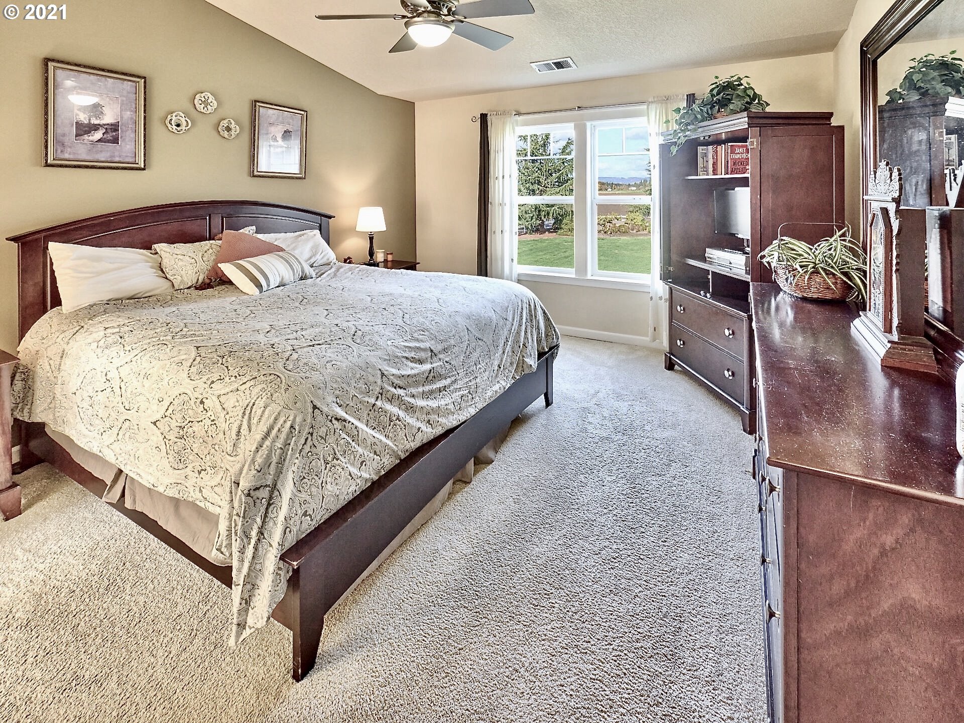3934 Mission Road Northeast St. Paul, OR 97137 - Photo 14 of 32 a bed sitting in a bedroom next to a window