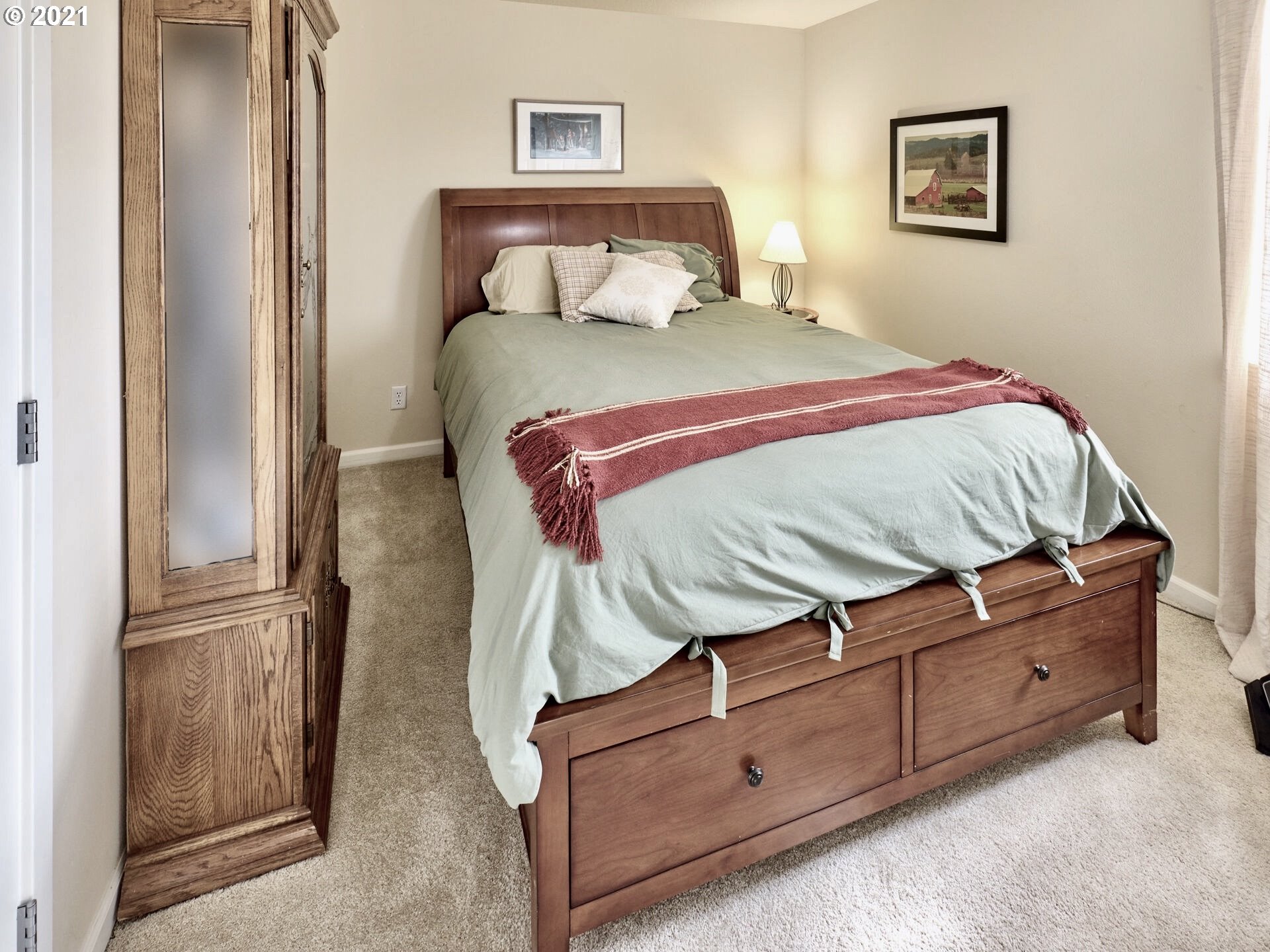 3934 Mission Road Northeast St. Paul, OR 97137 - Photo 17 of 32 a bedroom with a bed and a cabinets