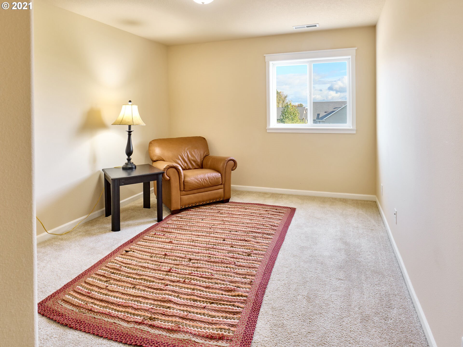 3934 Mission Road Northeast St. Paul, OR 97137 - Photo 18 of 32 a bedroom with furniture and a window