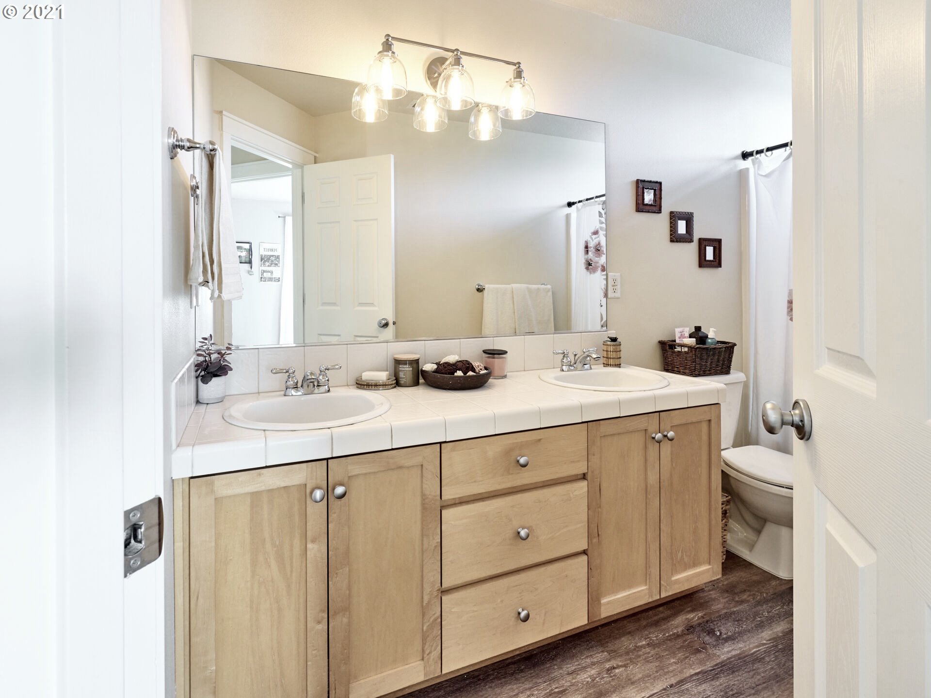 3934 Mission Road Northeast St. Paul, OR 97137 - Photo 20 of 32 a bathroom with a double vanity sink and a mirror