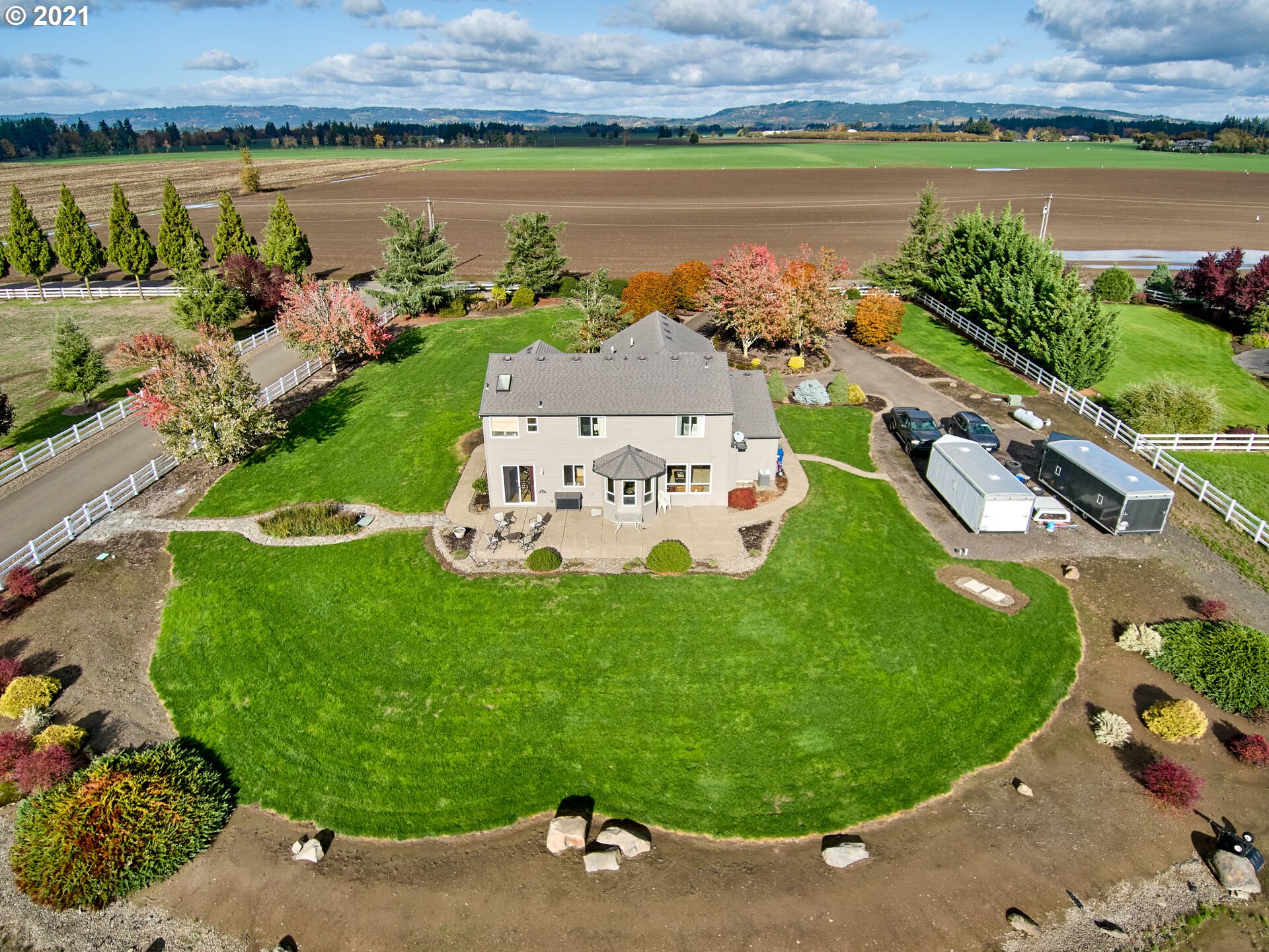 3934 Mission Road Northeast St. Paul, OR 97137 - Photo 22 of 32 an aerial view of a house with a garden and lake view