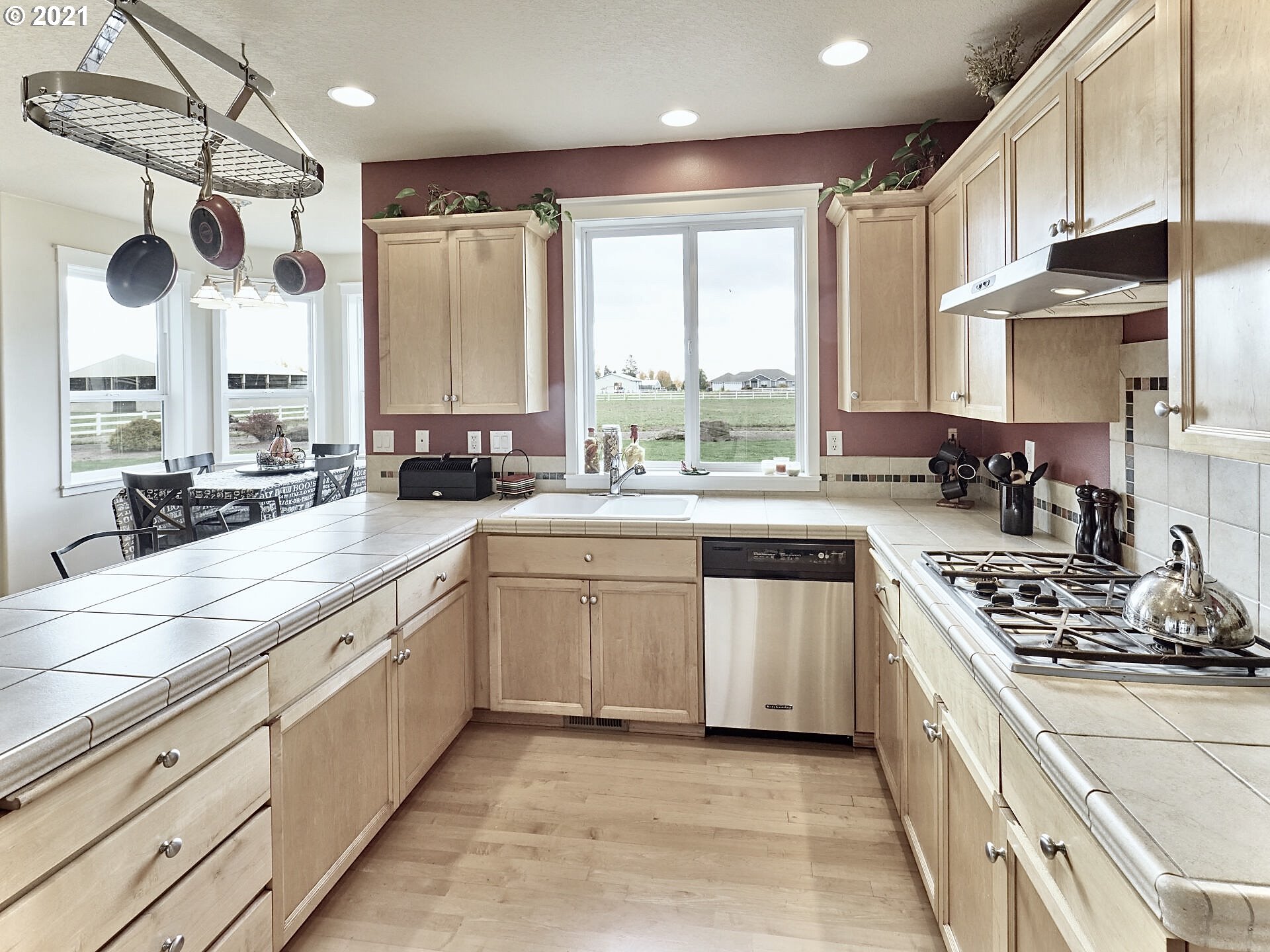 3934 Mission Road Northeast St. Paul, OR 97137 - Photo 9 of 32 a kitchen with stainless steel appliances a sink a stove a refrigerator and cabinets