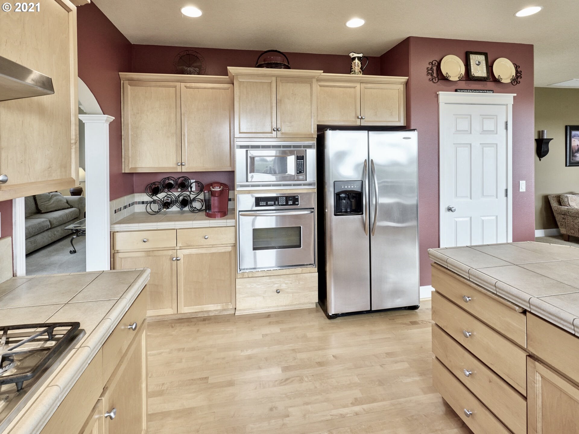 3934 Mission Road Northeast St. Paul, OR 97137 - Photo 10 of 32 a kitchen with stainless steel appliances granite countertop a refrigerator and a stove