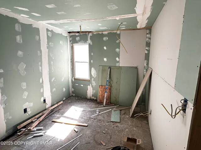 a view of a hallway with windows