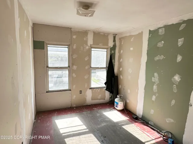 a view of an empty room and window