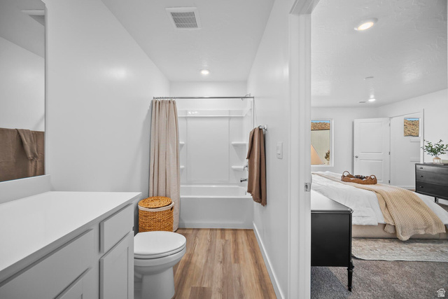 2123 Wolverine Way, Unit 2437 Washington, UT 84780 - Photo 40 of 40 Bathroom featuring a bathtub with shower, toilet, and a white vanity with countertop