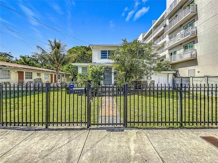 a view of a house with a iron gate