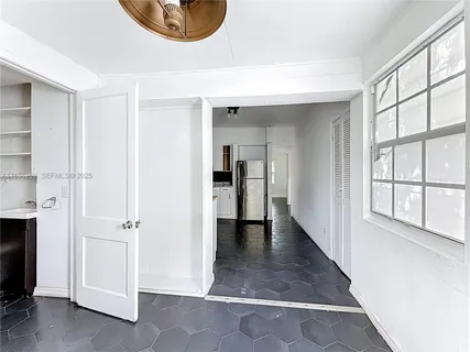 a view of an entryway with wooden floor