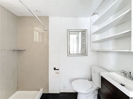 a bathroom with a toilet a sink and bathtub