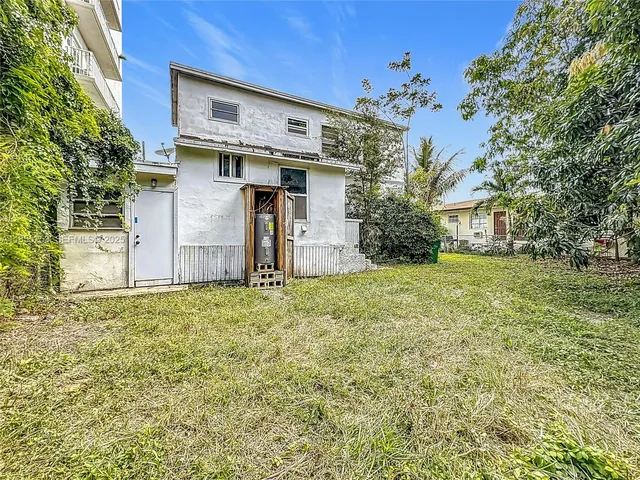 a house with trees in front of it