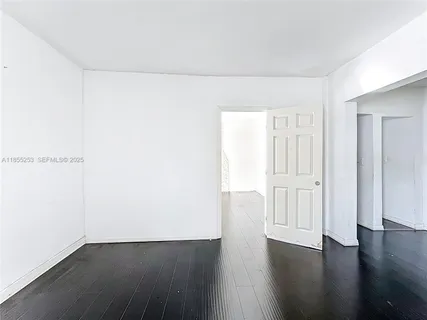 an empty room with wooden floor