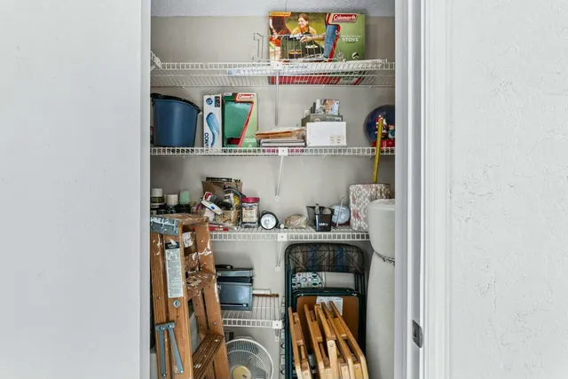 a kitchen with a refrigerator and cabinets
