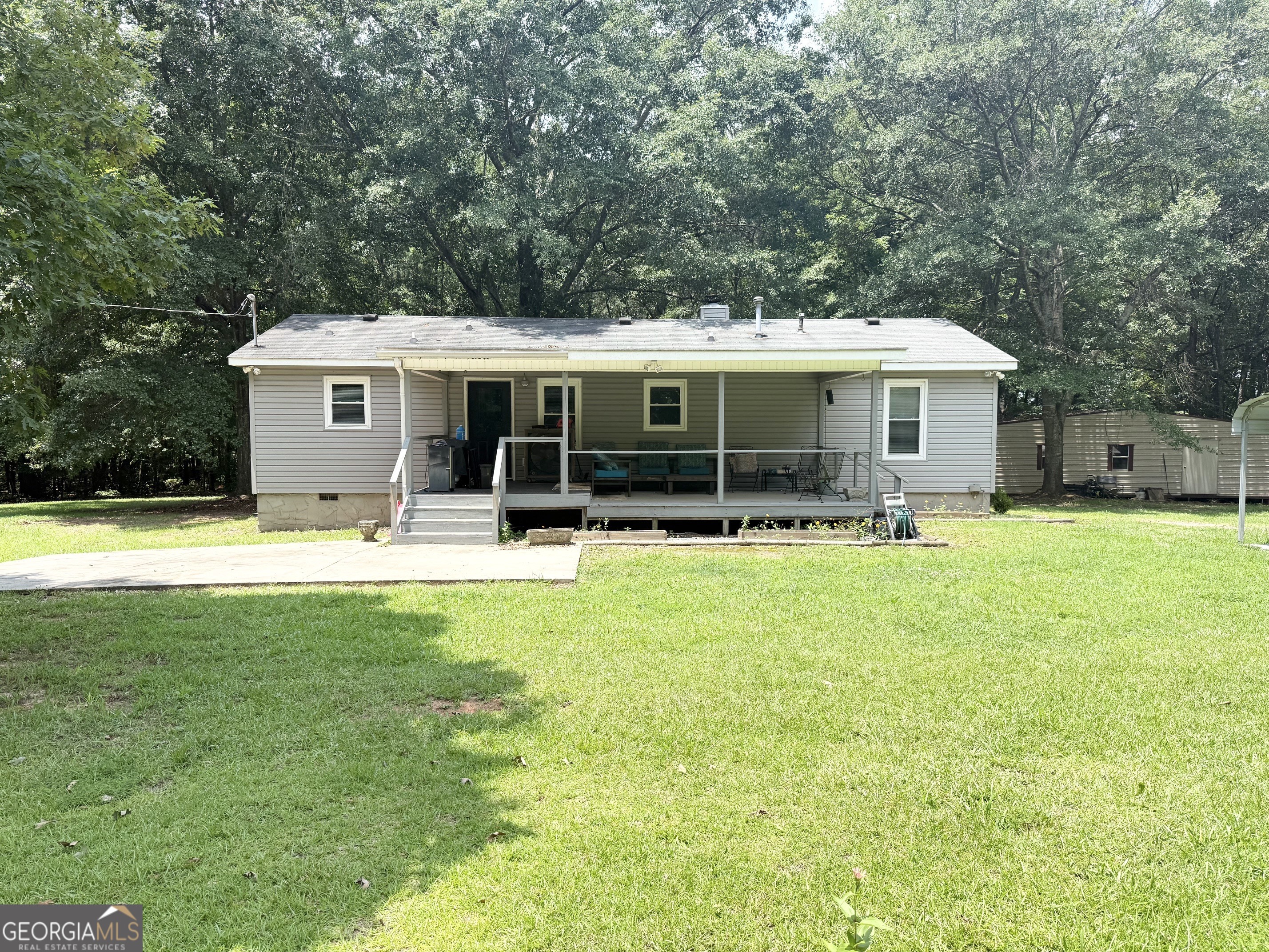 62 Melvin Harris Road Manchester, GA 31816 - Photo 46 of 52 a view of a house with swimming pool and a yard