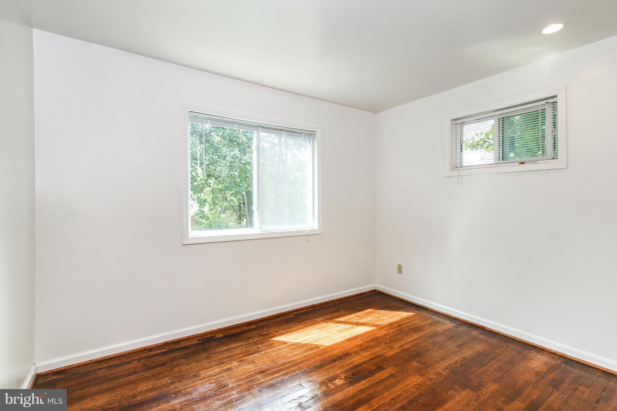 3306 Niles Street Silver Spring, MD 20906 - Photo 11 of 21 an empty room with wooden floor and windows