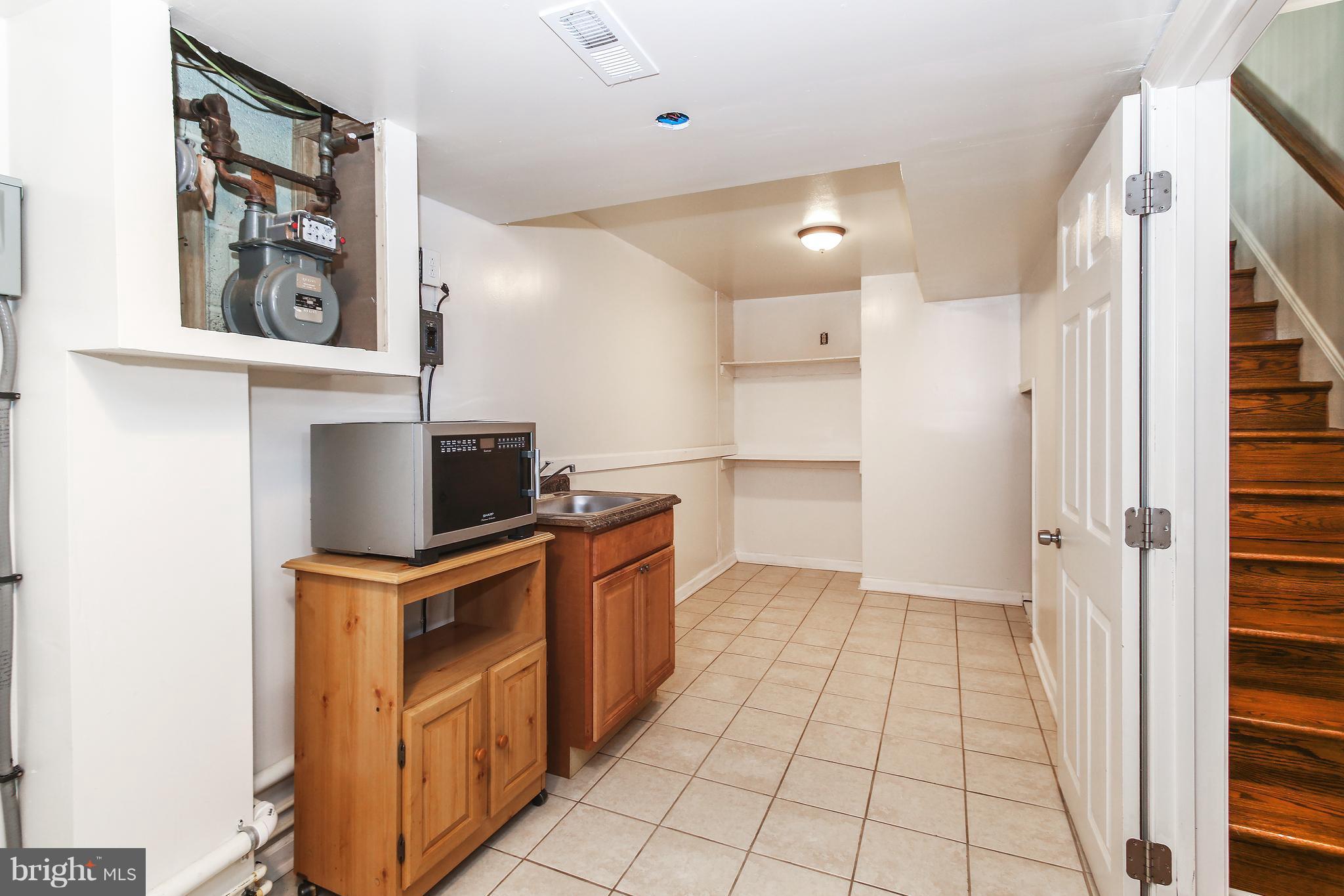 3306 Niles Street Silver Spring, MD 20906 - Photo 12 of 21 a kitchen with stainless steel appliances a refrigerator and a stove top oven