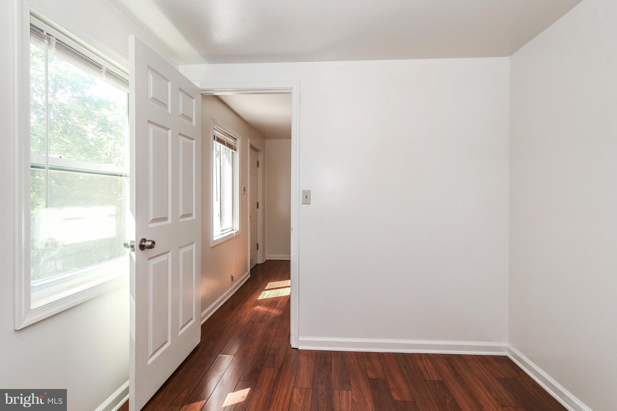3306 Niles Street Silver Spring, MD 20906 - Photo 14 of 21 a view of a hallway with wooden floor and a window