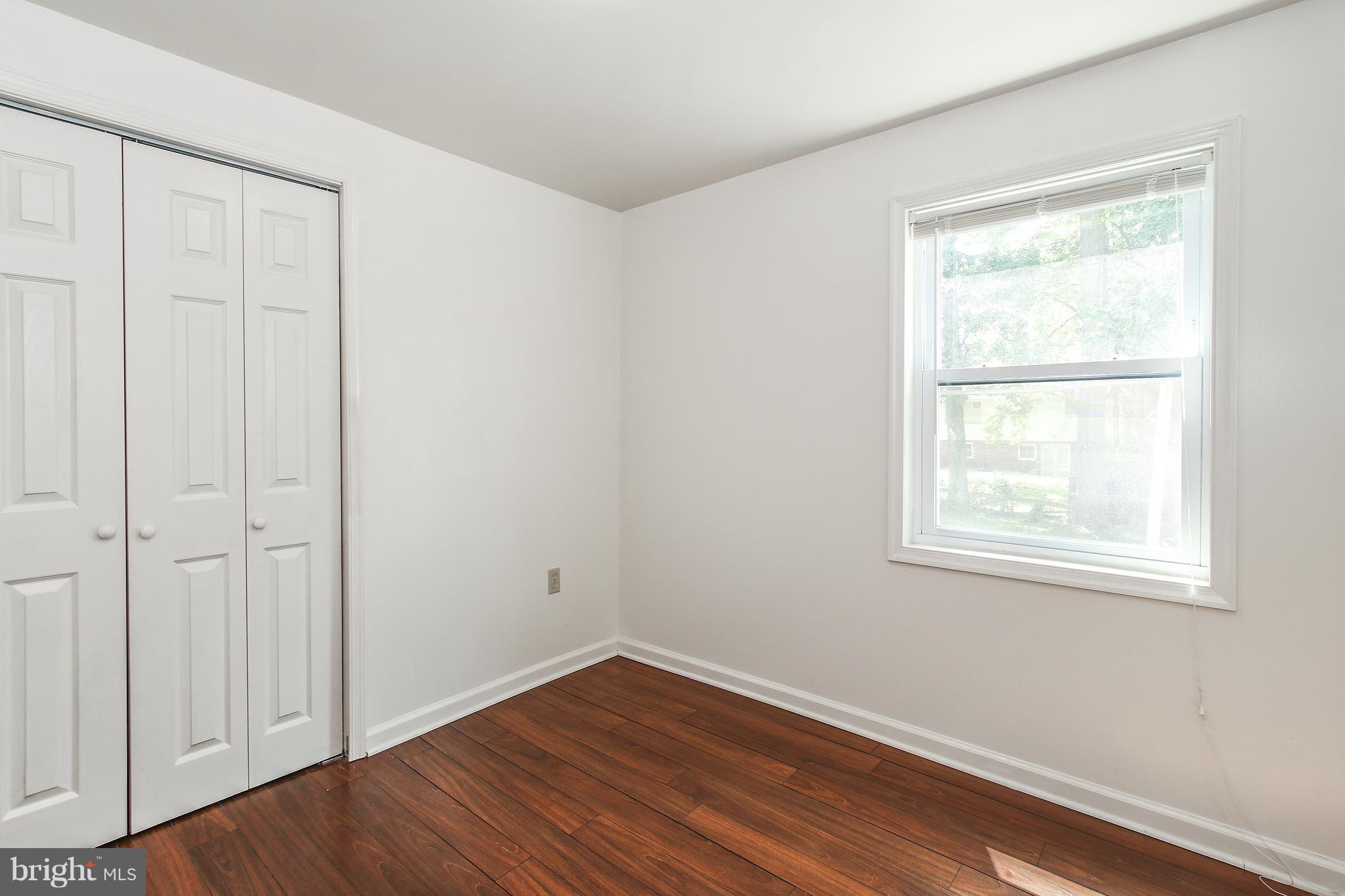 3306 Niles Street Silver Spring, MD 20906 - Photo 15 of 21 an empty room with wooden floor and windows