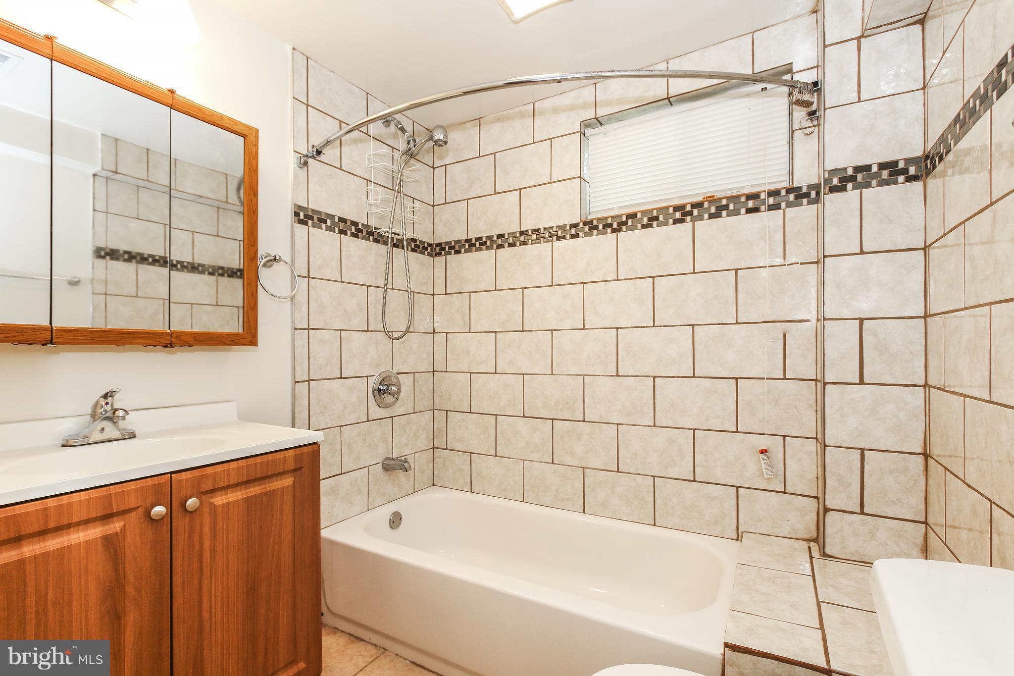 3306 Niles Street Silver Spring, MD 20906 - Photo 17 of 21 a bathroom with a bathtub and shower