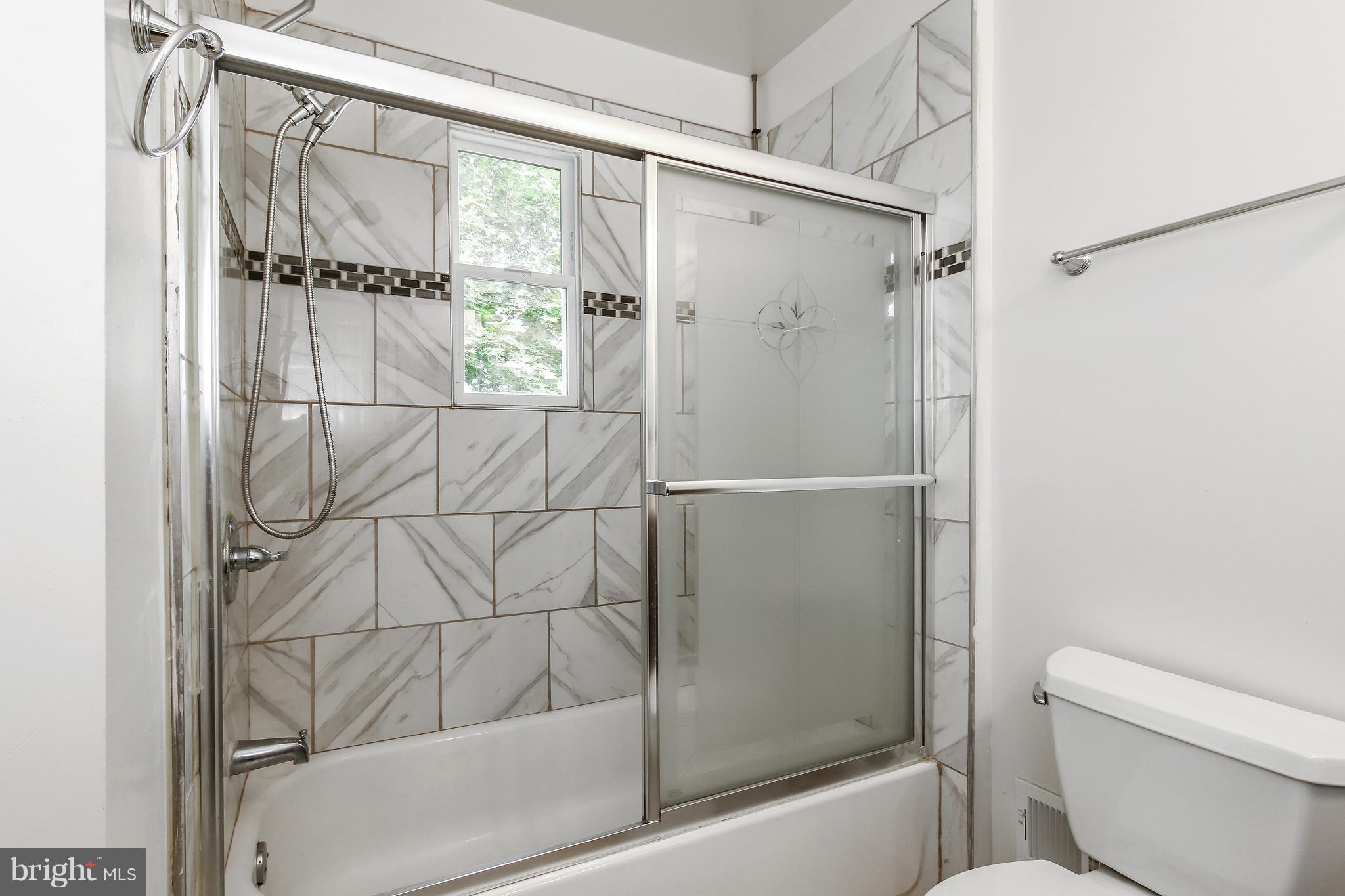 3306 Niles Street Silver Spring, MD 20906 - Photo 18 of 21 a bathroom with a shower and a toilet
