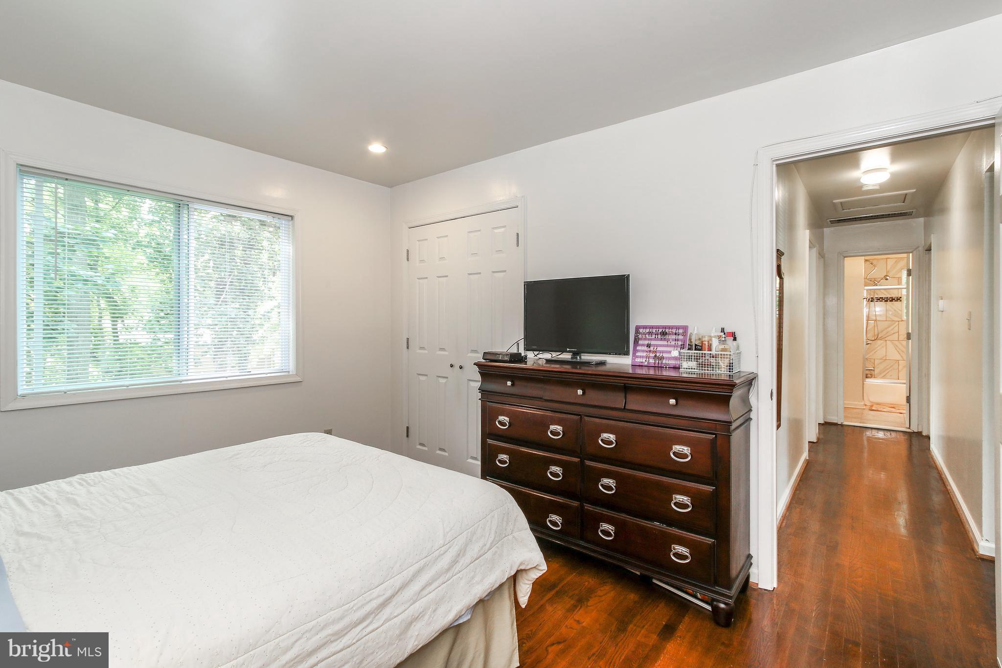 3306 Niles Street Silver Spring, MD 20906 - Photo 9 of 21 a bedroom with a bed and a flat screen tv