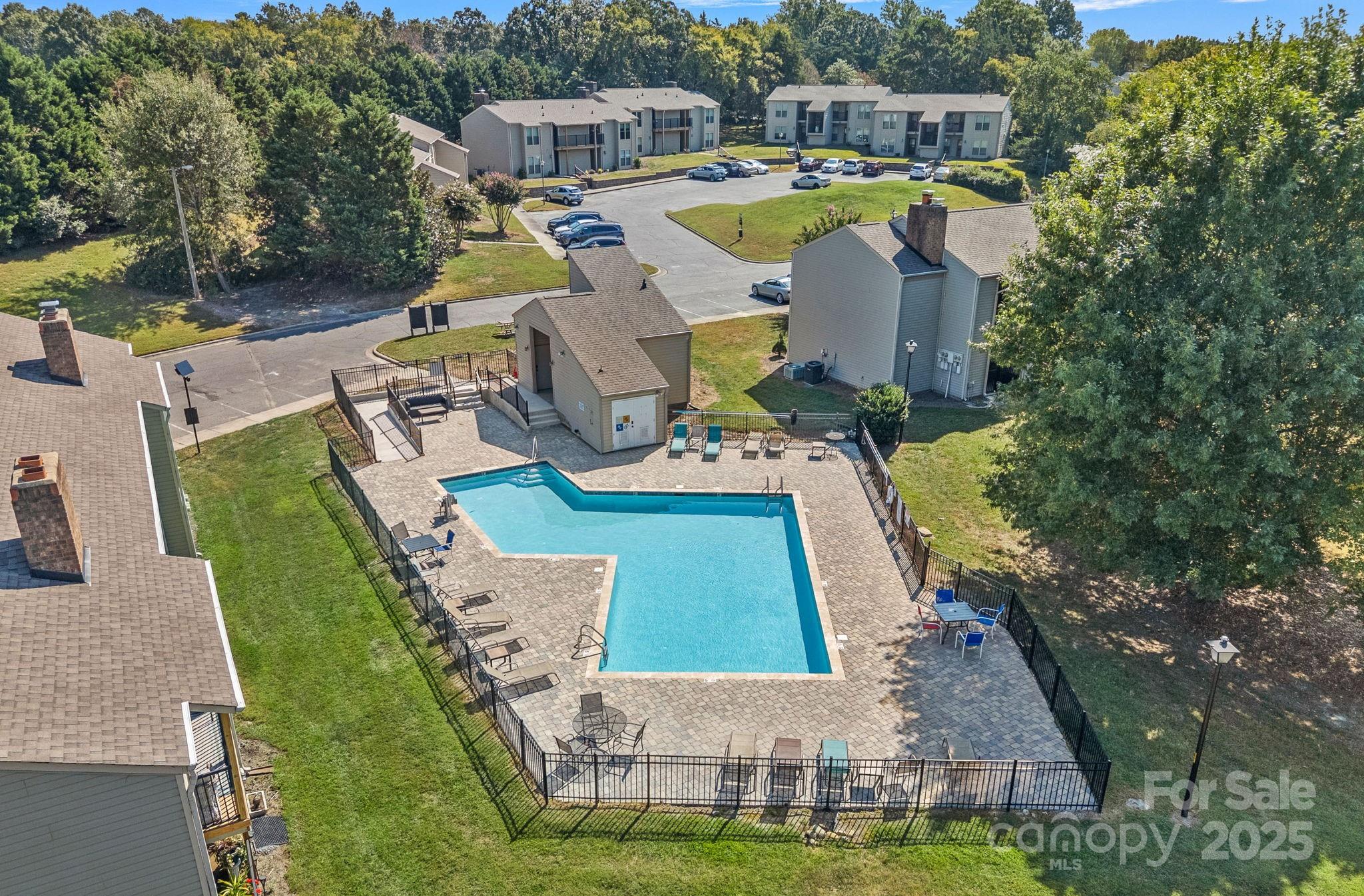 11017 Running Ridge Road Charlotte, NC 28226 - Photo 3 of 27 a view of a house with swimming pool