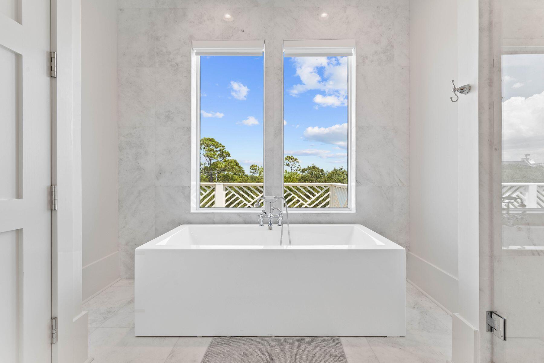 78 Banfill Road Santa Rosa Beach, FL 32459 - Photo 45 of 62 a white bath tub sitting in a bathroom