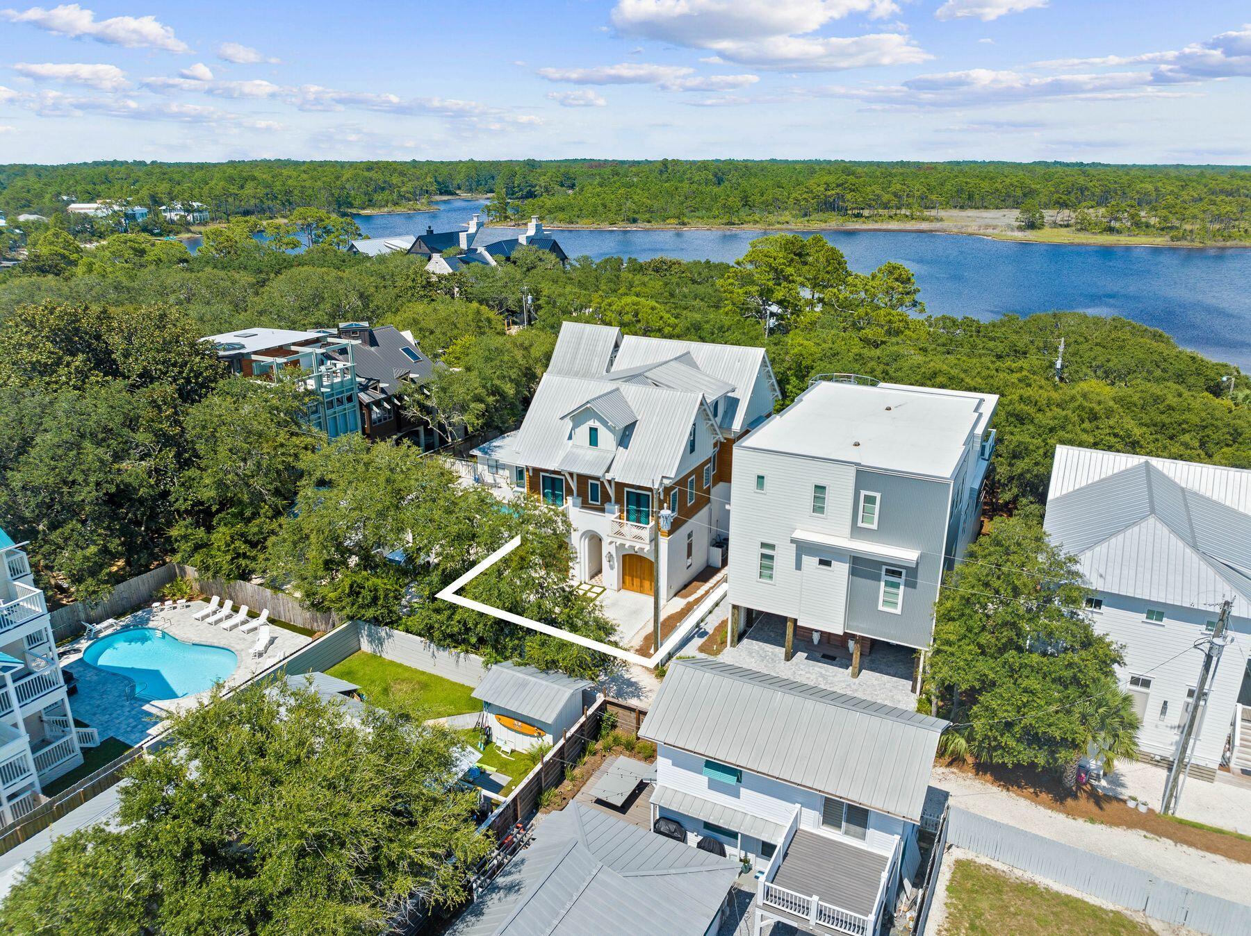 78 Banfill Road Santa Rosa Beach, FL 32459 - Photo 62 of 62 an aerial view of a house with a lake view