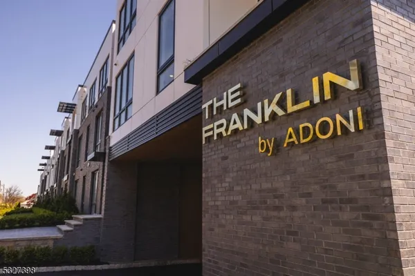 a brick building with a street sign on it