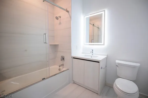 a bathroom with a toilet sink and bathtub
