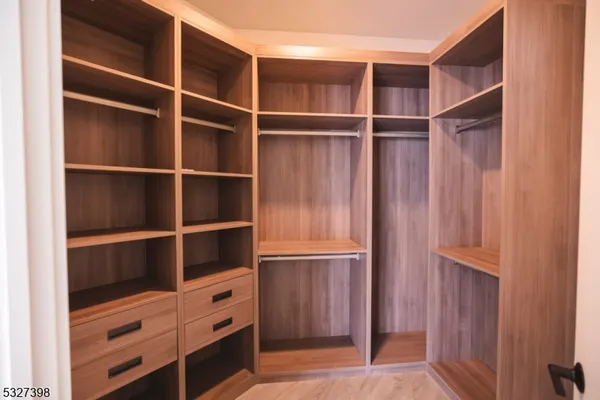 a view of an empty walk in closet