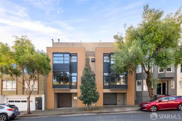 a cars parked in front of a building