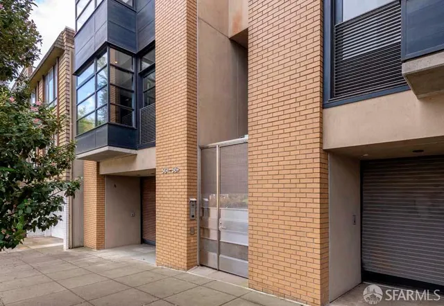 a view of a house with a door and wooden floor