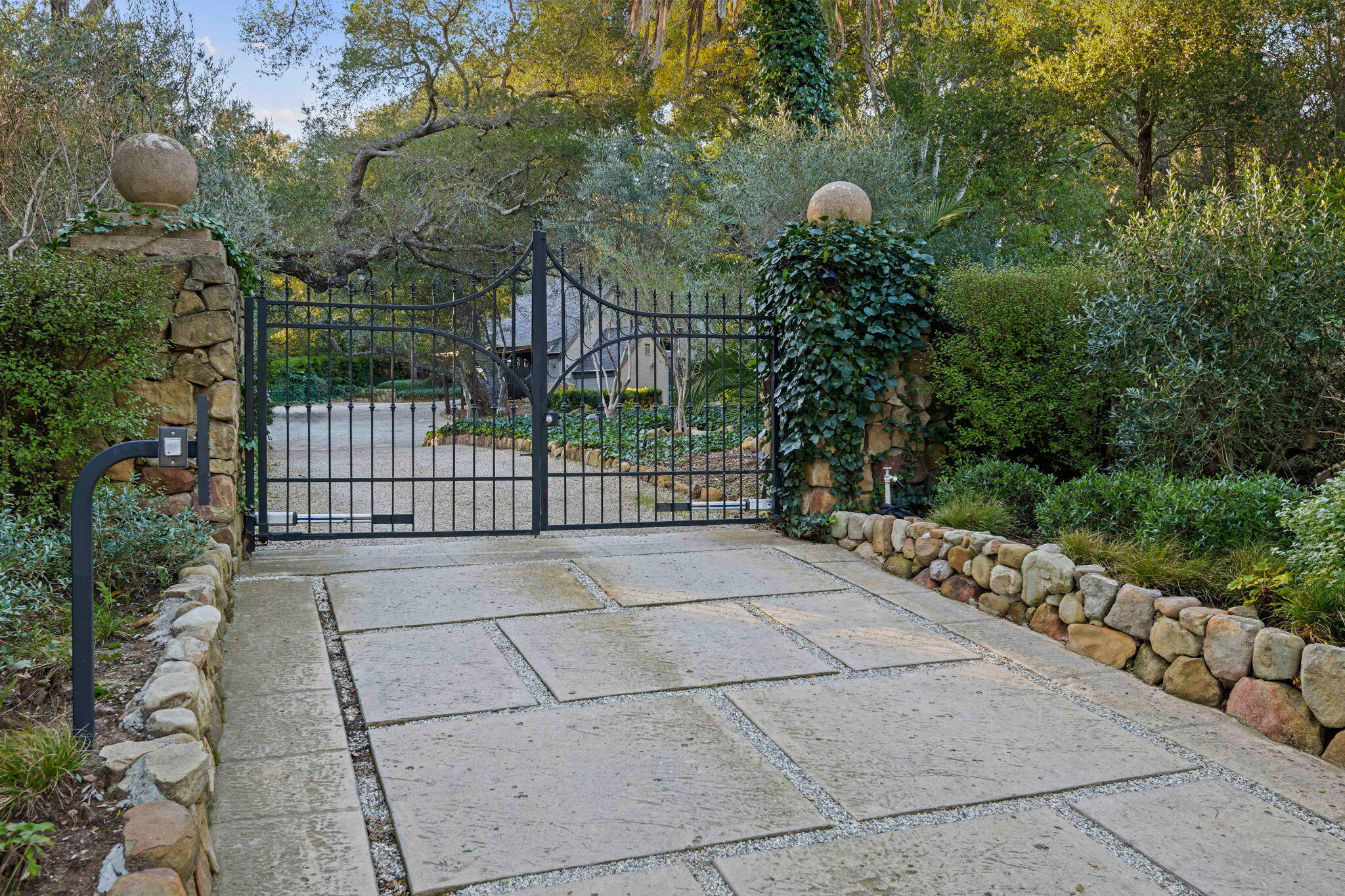 a view of a pathway along with wooden fence