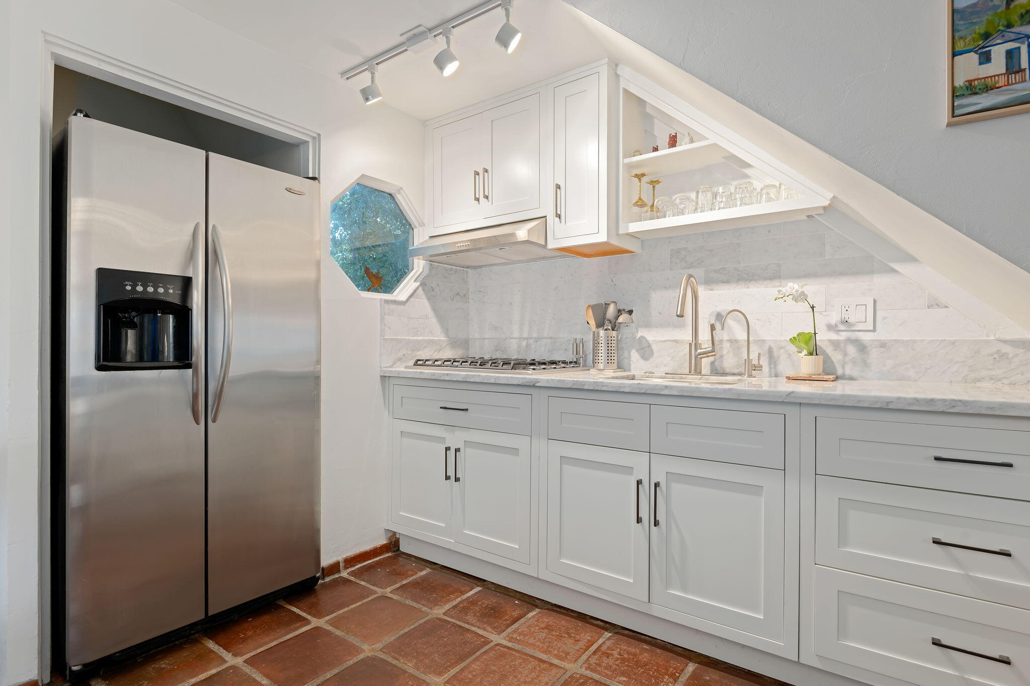 811 Picacho Lane Montecito, CA 93108 - Photo 13 of 22 a kitchen with white cabinets and refrigerator