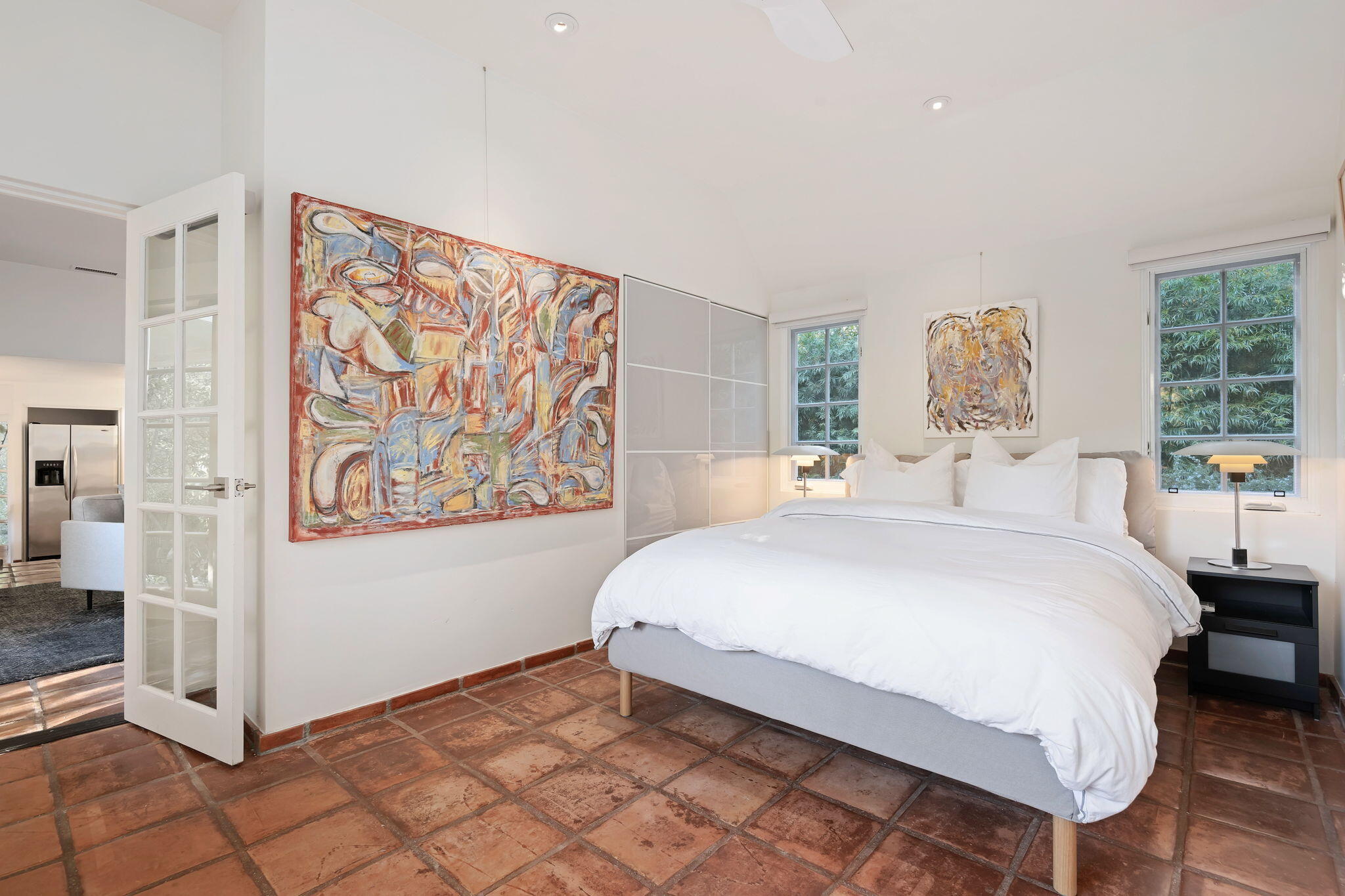 811 Picacho Lane Montecito, CA 93108 - Photo 16 of 22 a bedroom with a bed and a painting on the wall