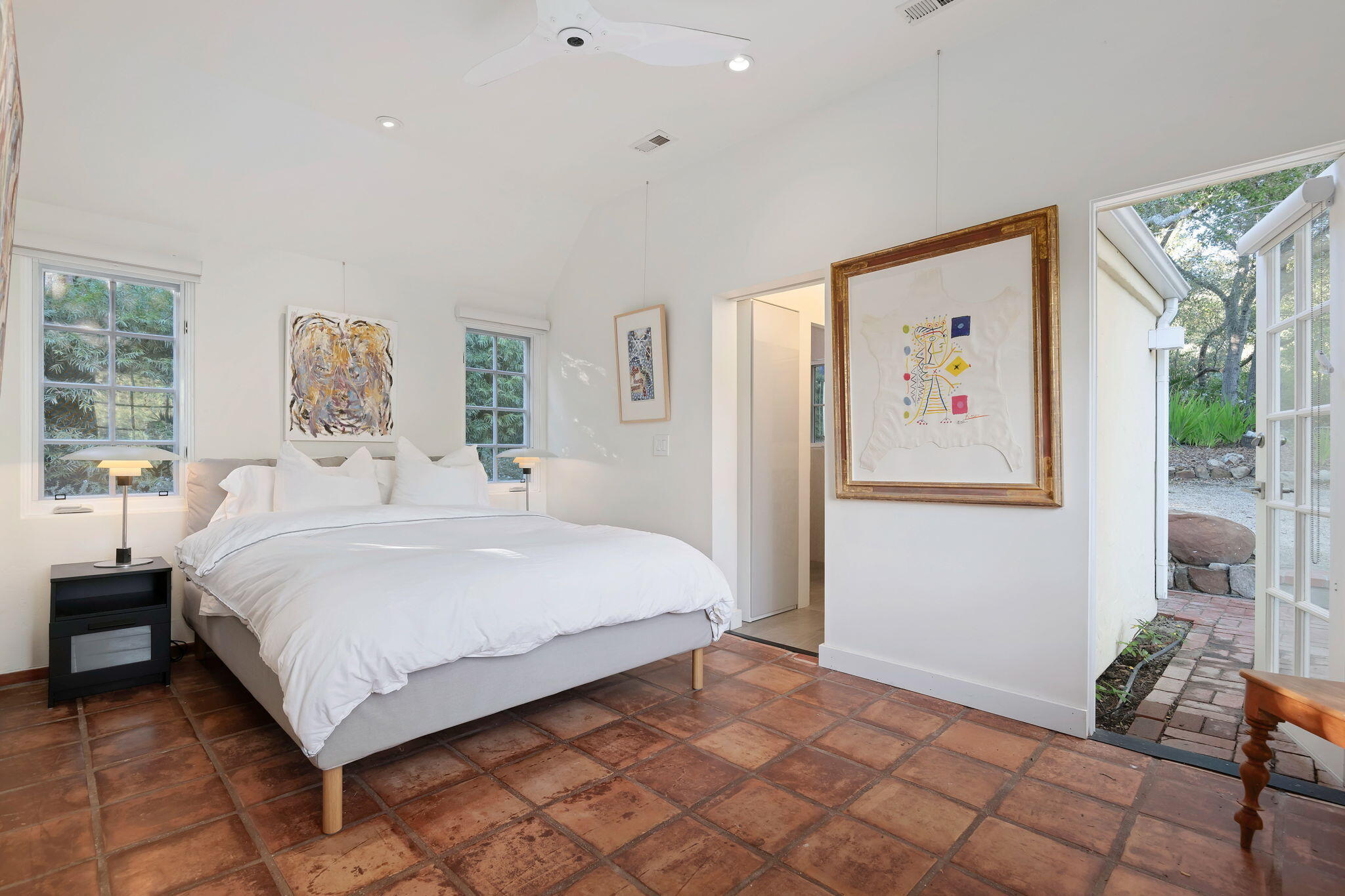 0 Picacho Lane Montecito, CA 93108 - Photo 16 of 25 a bedroom with a bed and a painting on the wall