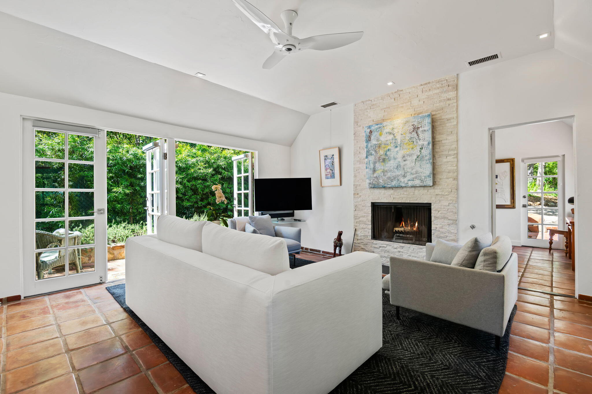 0 Picacho Lane Montecito, CA 93108 - Photo 7 of 25 a living room with furniture a flat screen tv and a fireplace