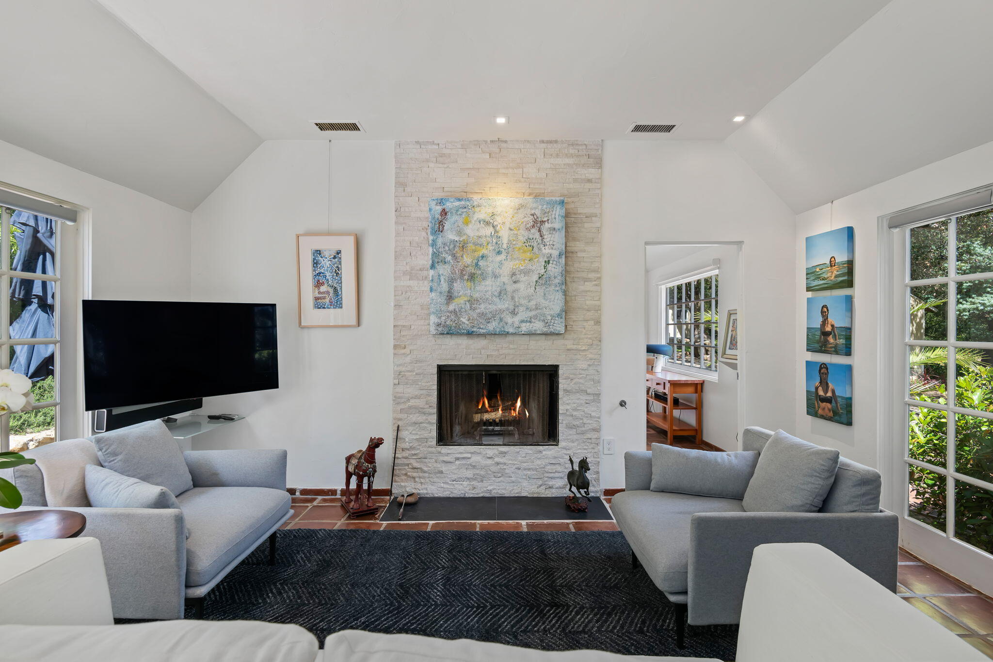 0 Picacho Lane Montecito, CA 93108 - Photo 9 of 25 a living room with furniture a fireplace and a flat screen tv