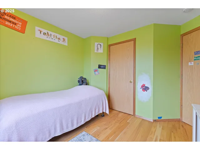 a bedroom with a bed and a table