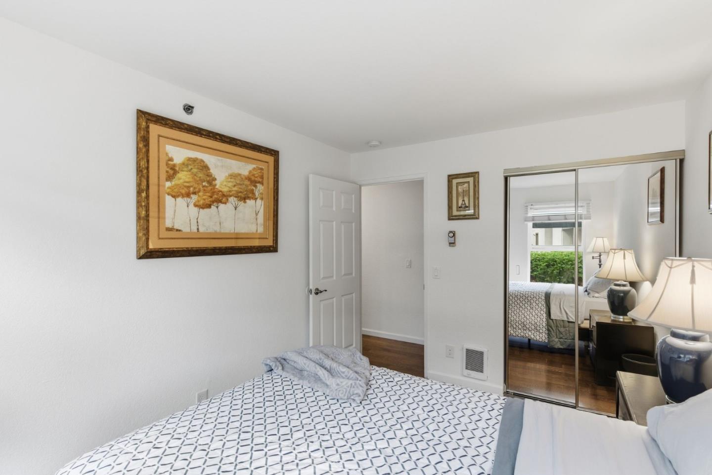 673 Royston Lane, Unit 233 Hayward, CA 94544 - Photo 16 of 32 a bedroom with furniture and a window