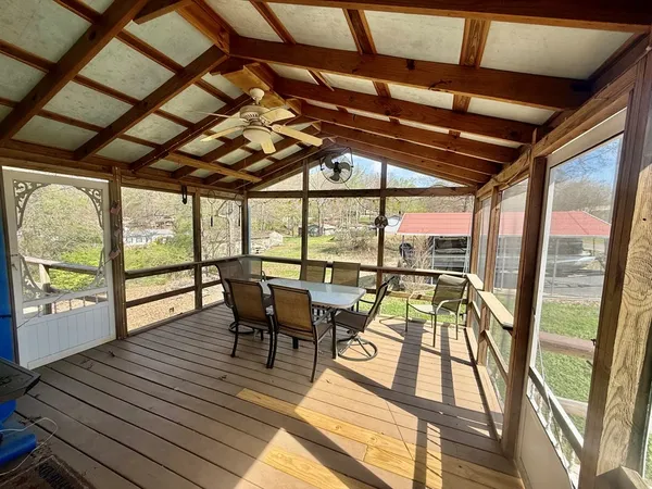 a view of a patio with wooden floor